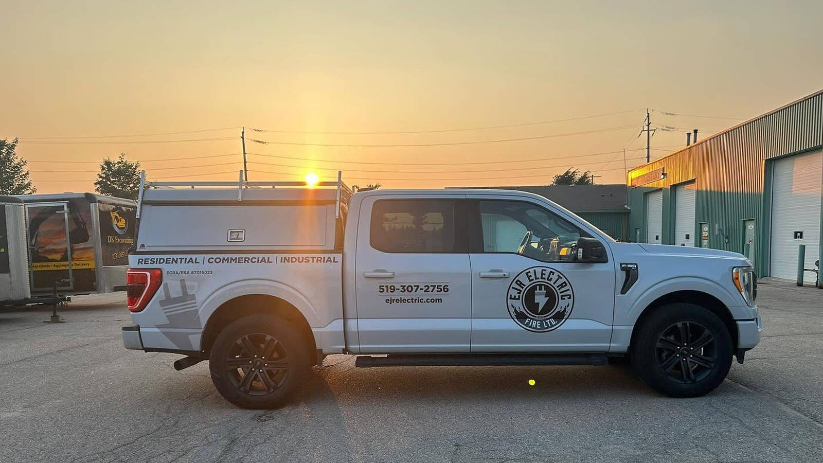 EJR Electric service truck parked outside during sunset, offering 24-hour emergency electrician services.