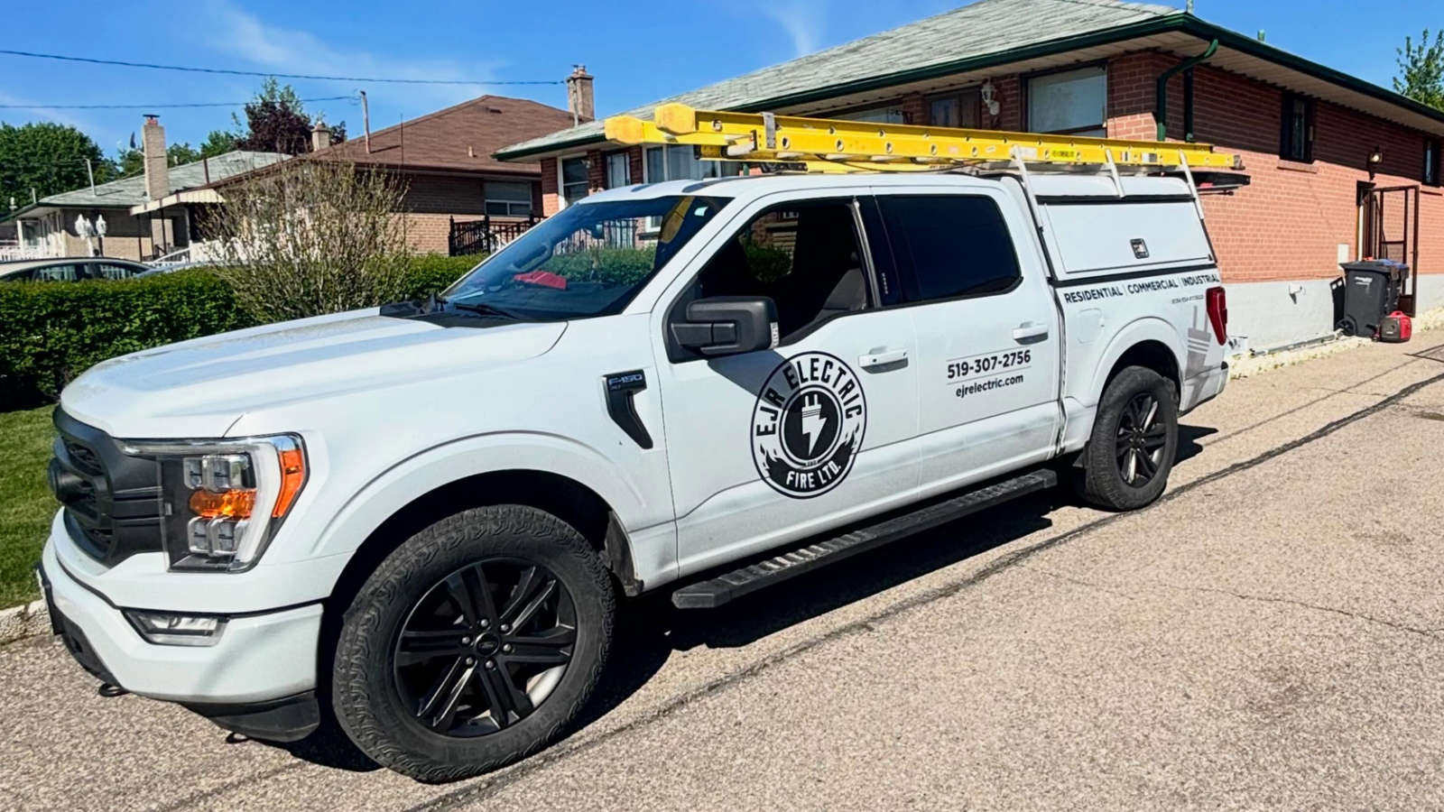 EJR Electric service truck parked outside a residential home ready for electrical and lighting installation projects in Orangeville.